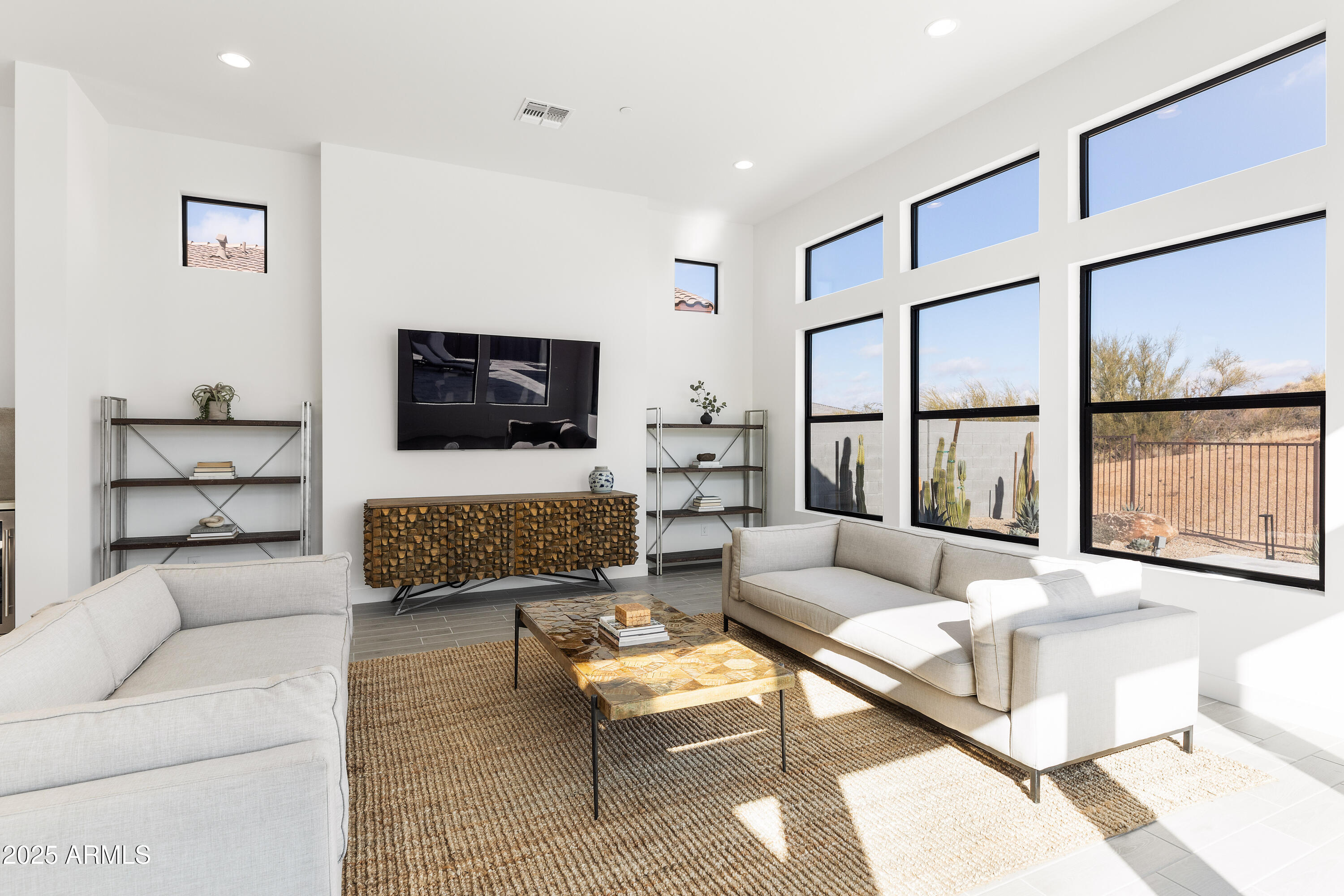 13238 East Ranch Gate Road Scottsdale, AZ 85255 - Photo 21 of 66 a living room with furniture and a flat screen tv