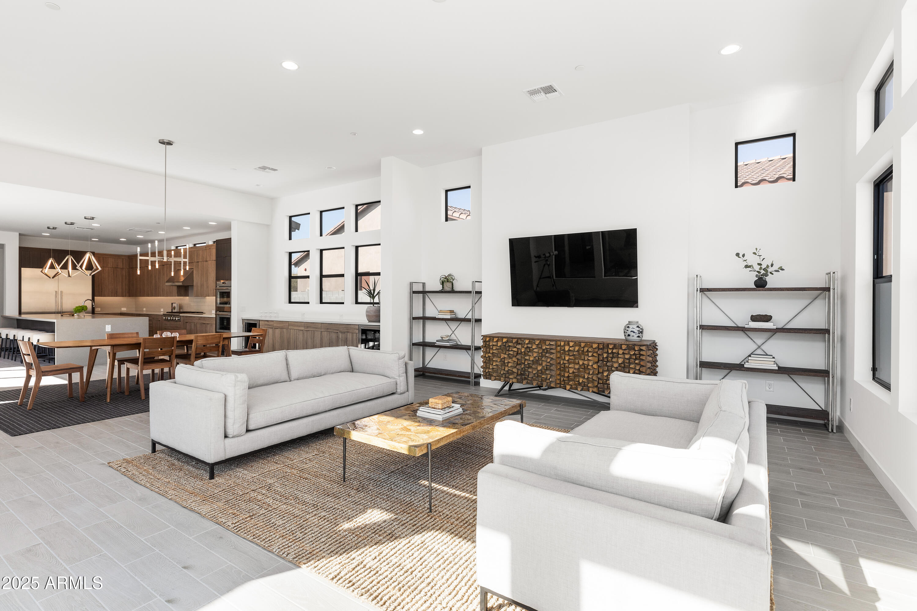 13238 East Ranch Gate Road Scottsdale, AZ 85255 - Photo 22 of 66 a living room with furniture and a flat screen tv