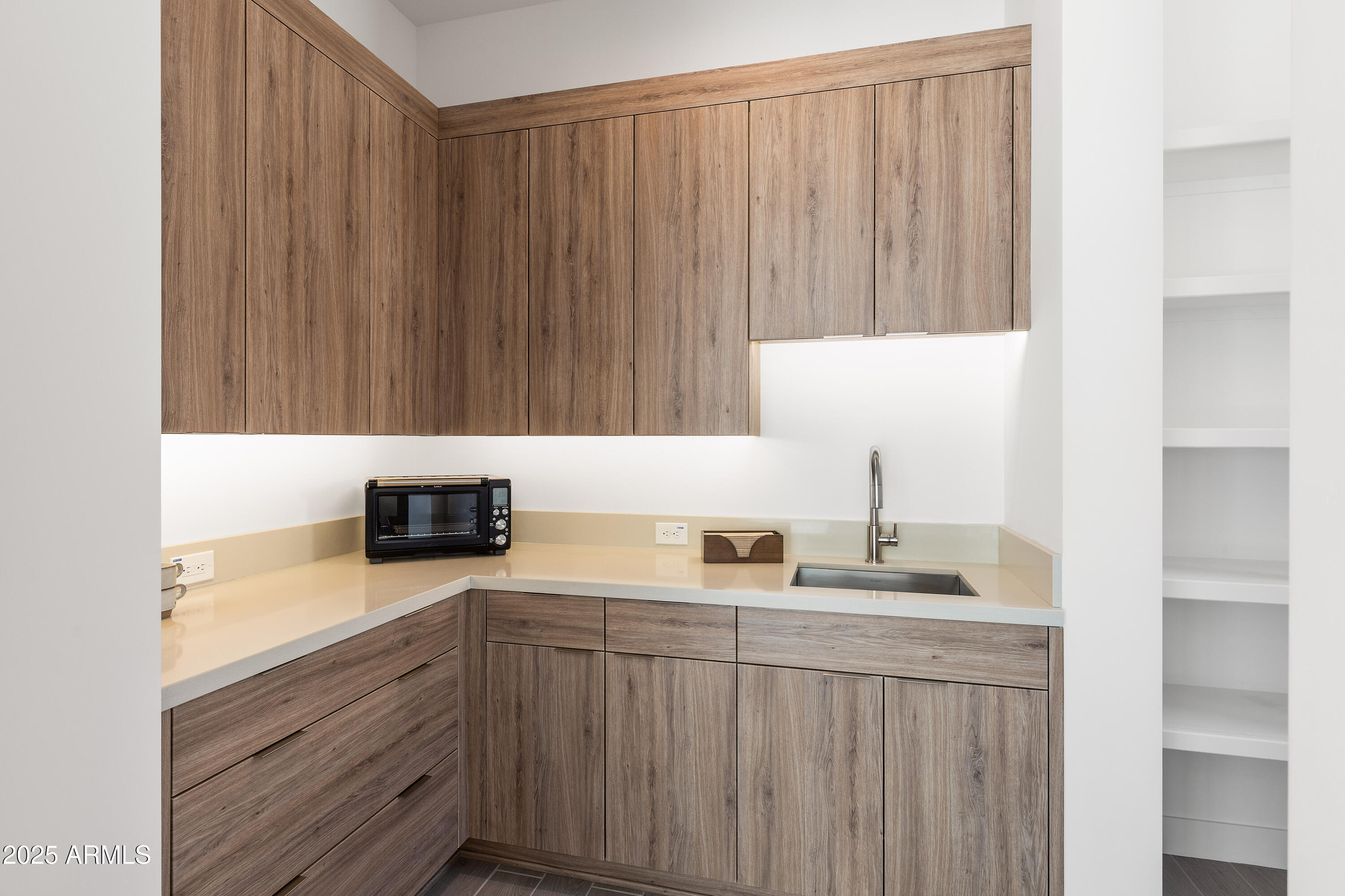 13238 East Ranch Gate Road Scottsdale, AZ 85255 - Photo 23 of 66 a kitchen with a sink and cabinets