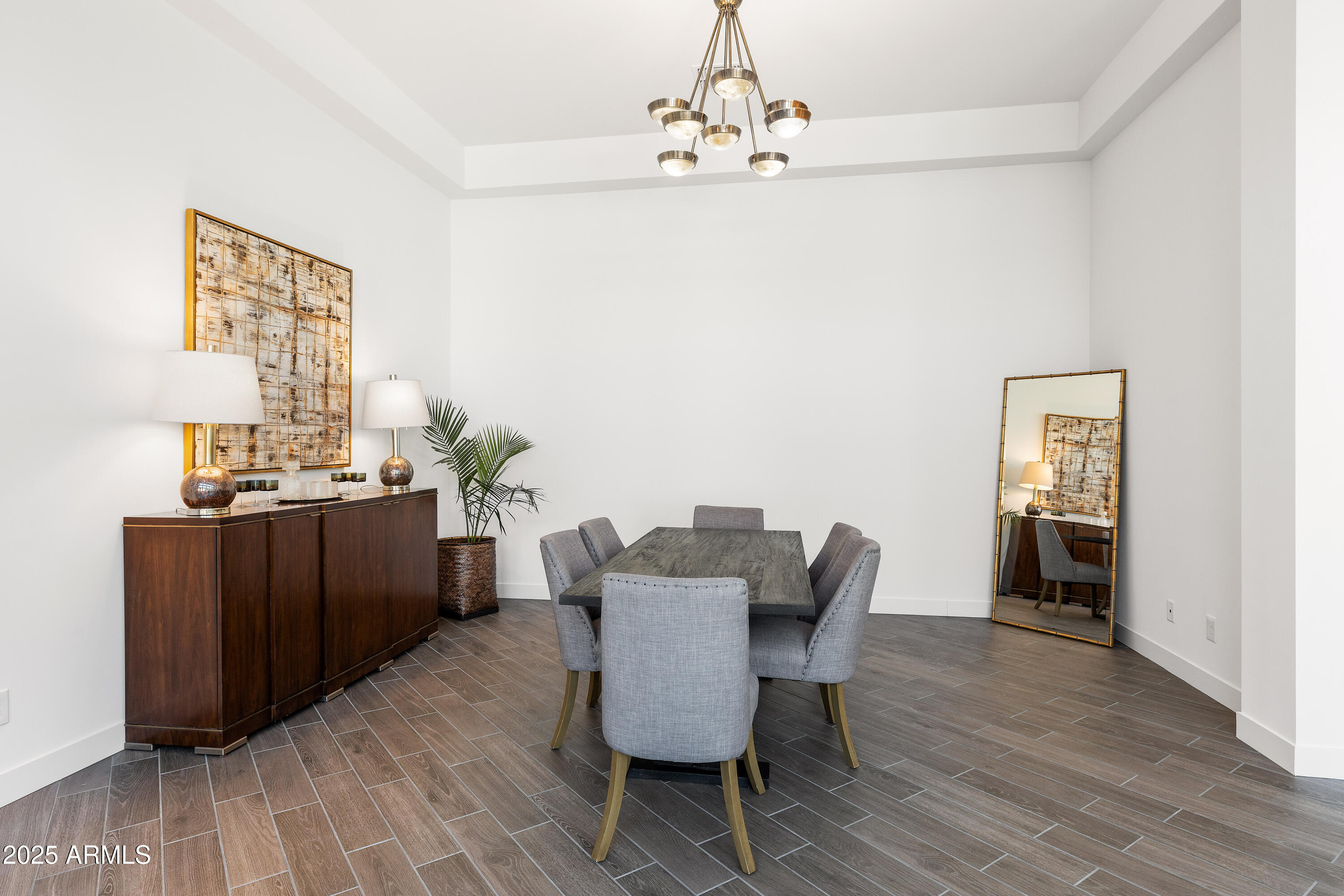 13238 East Ranch Gate Road Scottsdale, AZ 85255 - Photo 24 of 66 a view of a dining room with furniture and wooden floor
