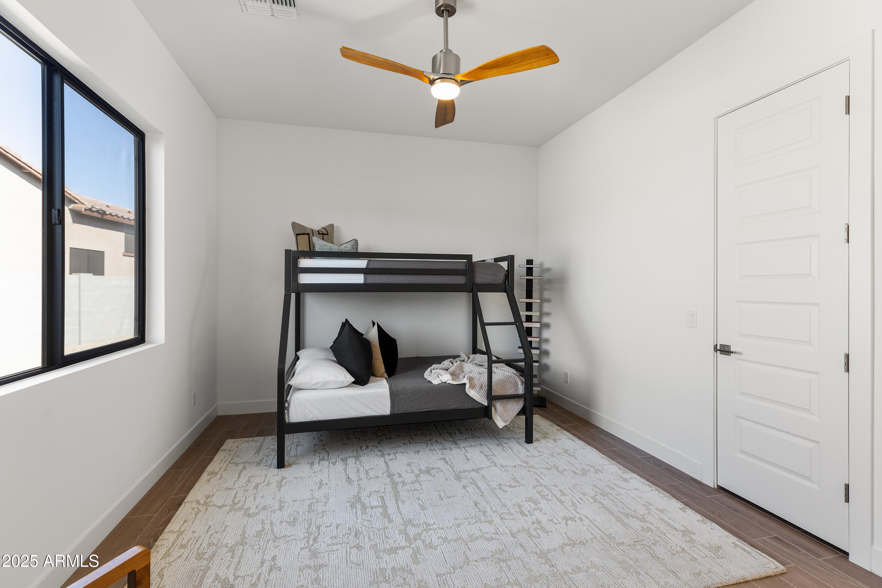 13238 East Ranch Gate Road Scottsdale, AZ 85255 - Photo 40 of 66 a bedroom with bunk bed and a window