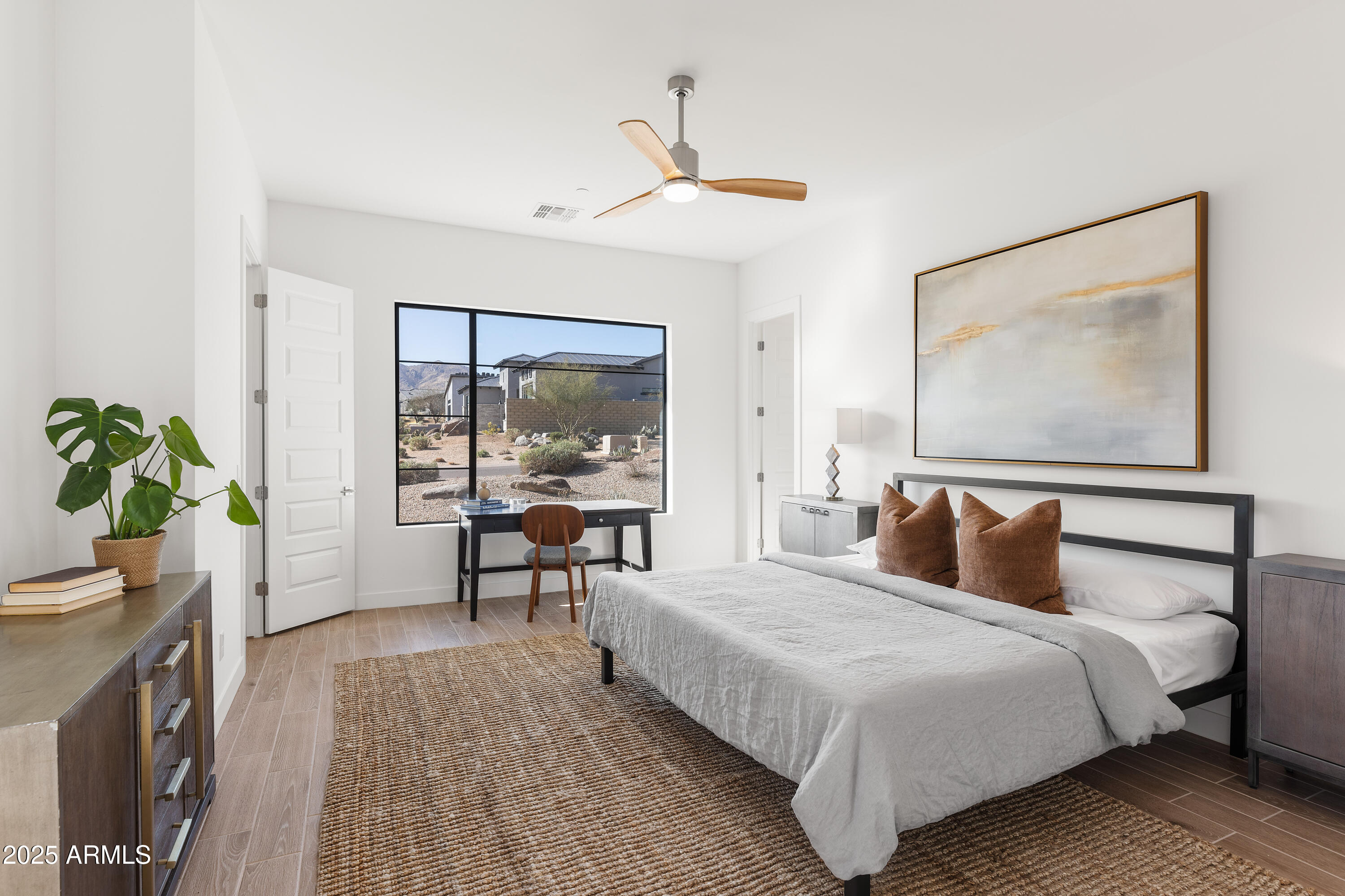 13238 East Ranch Gate Road Scottsdale, AZ 85255 - Photo 42 of 66 a bedroom with a bed and a potted plant