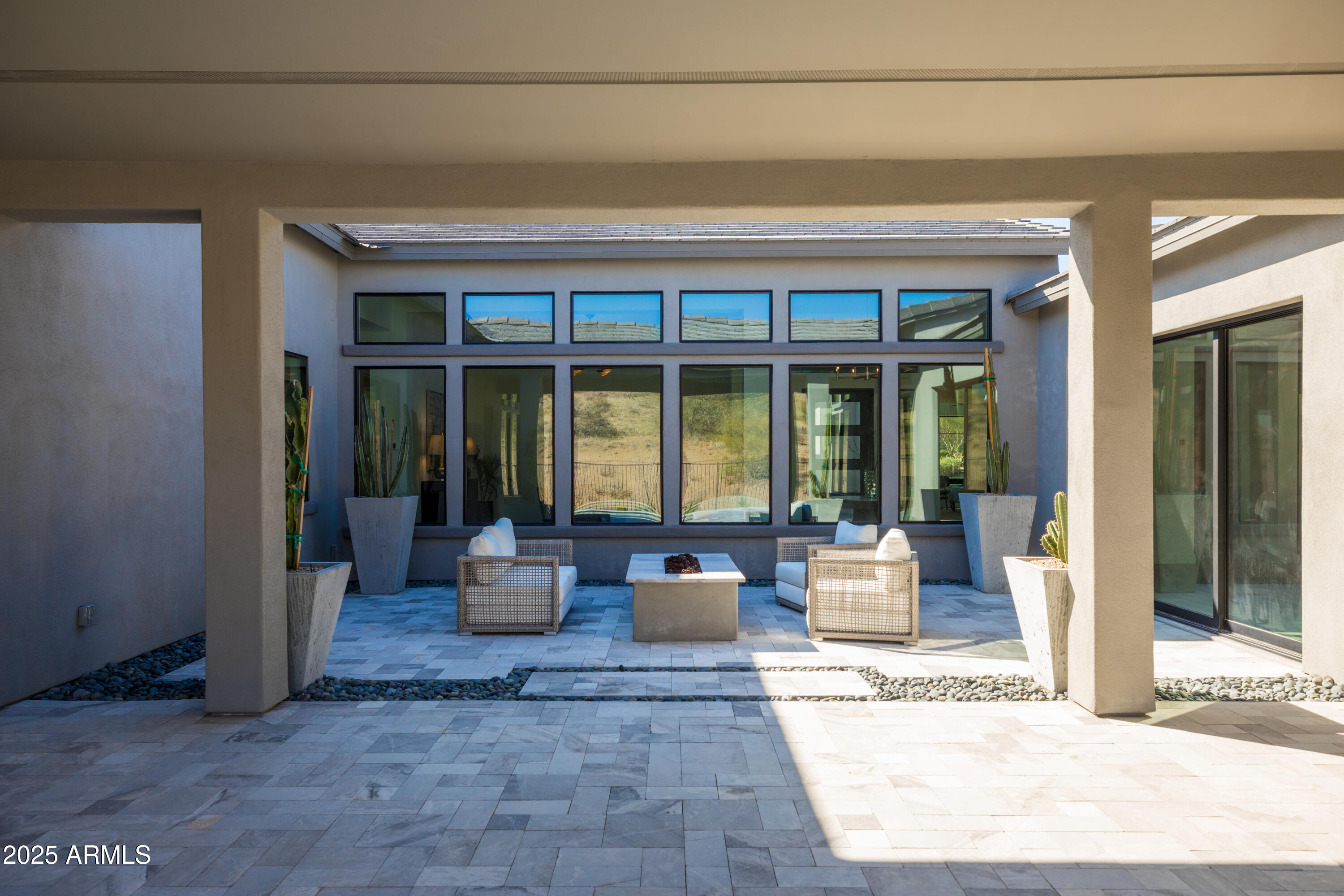 13238 East Ranch Gate Road Scottsdale, AZ 85255 - Photo 49 of 66 a living room with furniture and floor to ceiling windows