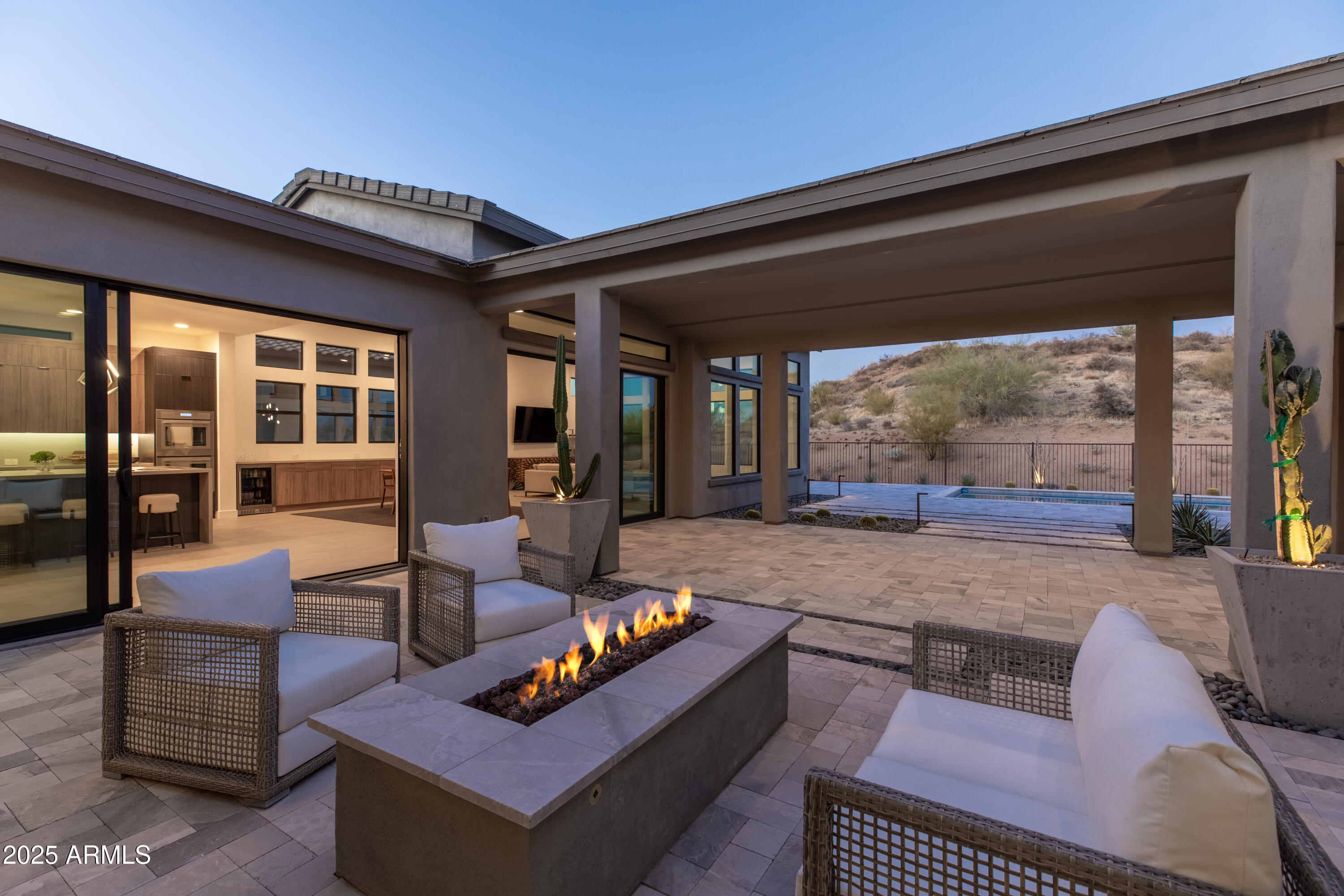 13238 East Ranch Gate Road Scottsdale, AZ 85255 - Photo 4 of 66 a living room with patio furniture and a large window