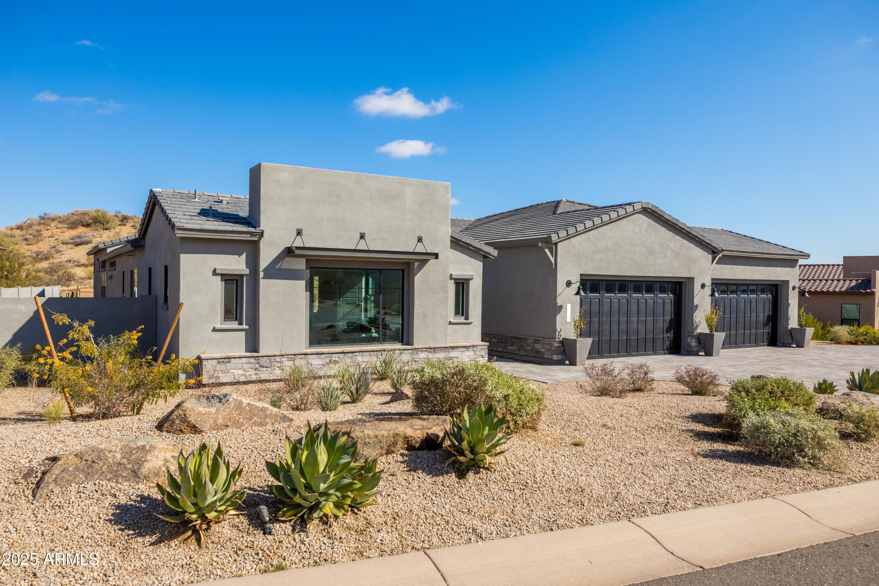13238 East Ranch Gate Road Scottsdale, AZ 85255 - Photo 60 of 66 a front view of a house with a yard