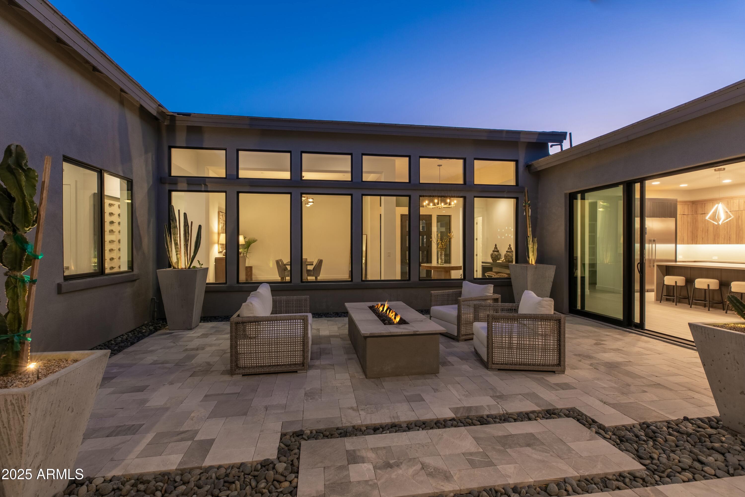 13238 East Ranch Gate Road Scottsdale, AZ 85255 - Photo 8 of 66 a living room with furniture and large windows