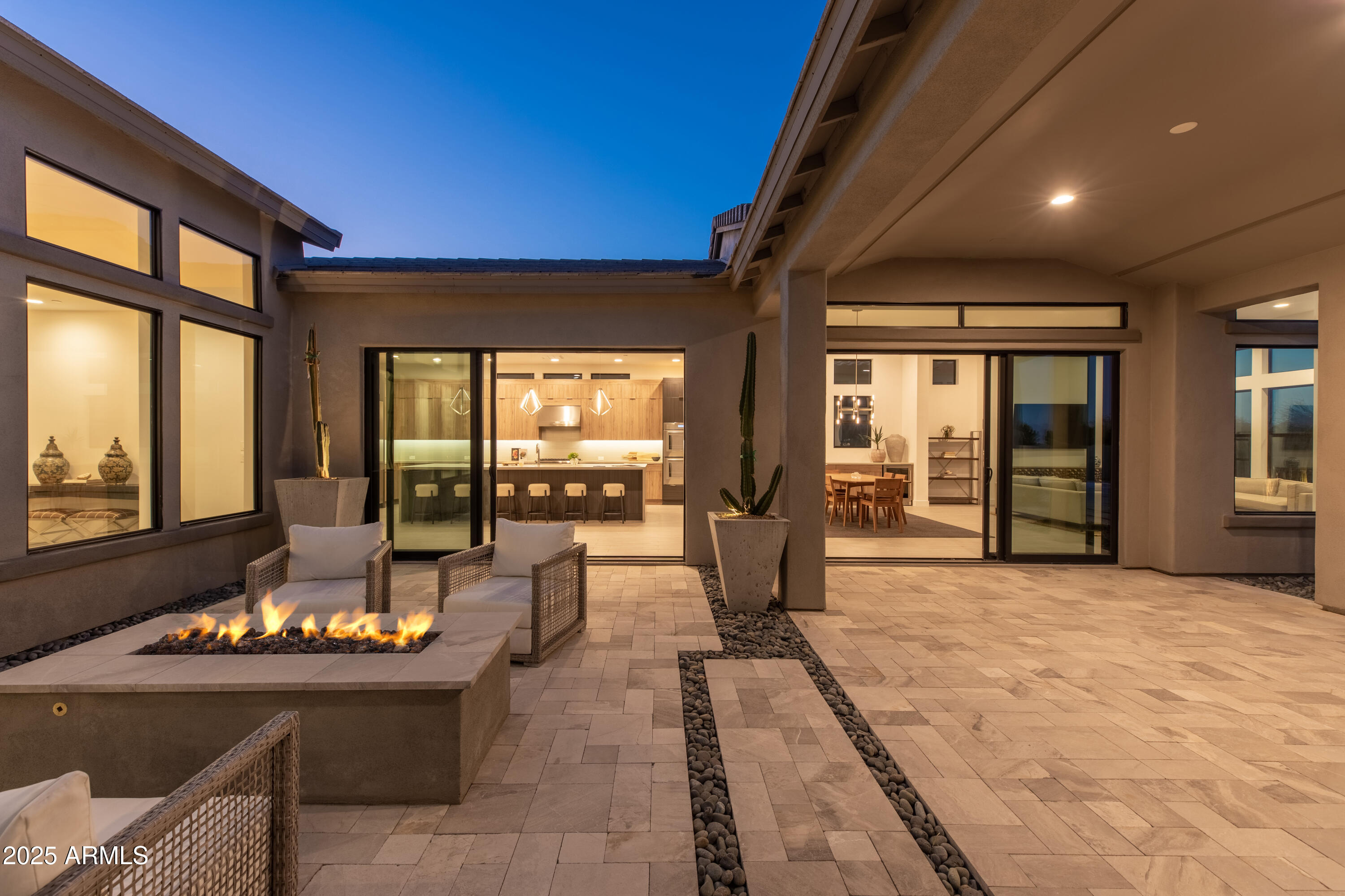 13238 East Ranch Gate Road Scottsdale, AZ 85255 - Photo 9 of 66 a living room with fireplace furniture and floor to ceiling windows