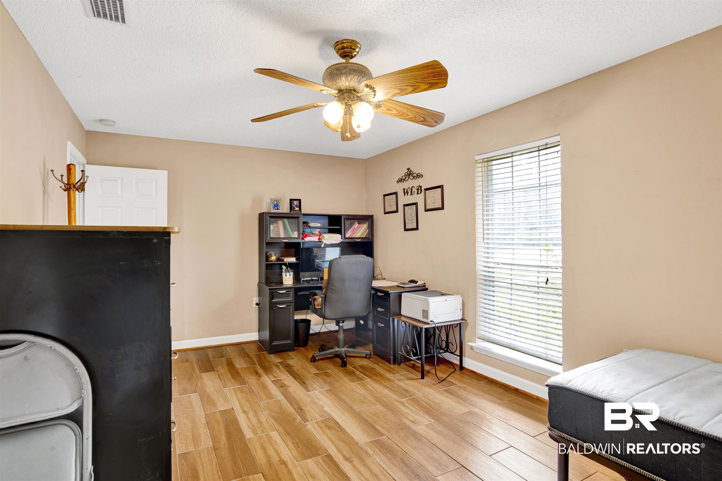 36434 Alexandria Trail Stapleton, AL 36578 - Photo 15 of 27 Office space featuring wood finish floors, a textured ceiling, and a ceiling fan