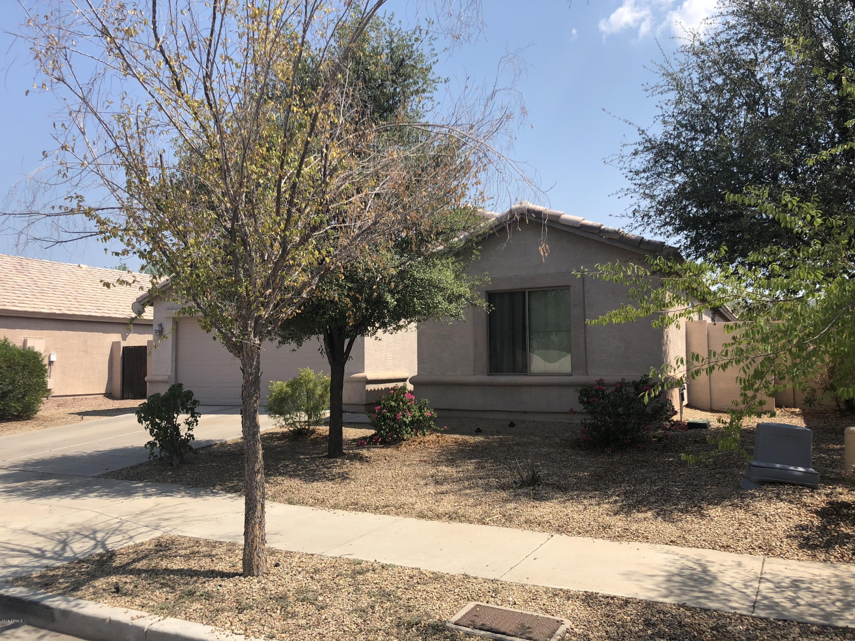 2321 West Maldonado Road Phoenix, AZ 85041 - Photo 1 of 44 a front view of a house with yard