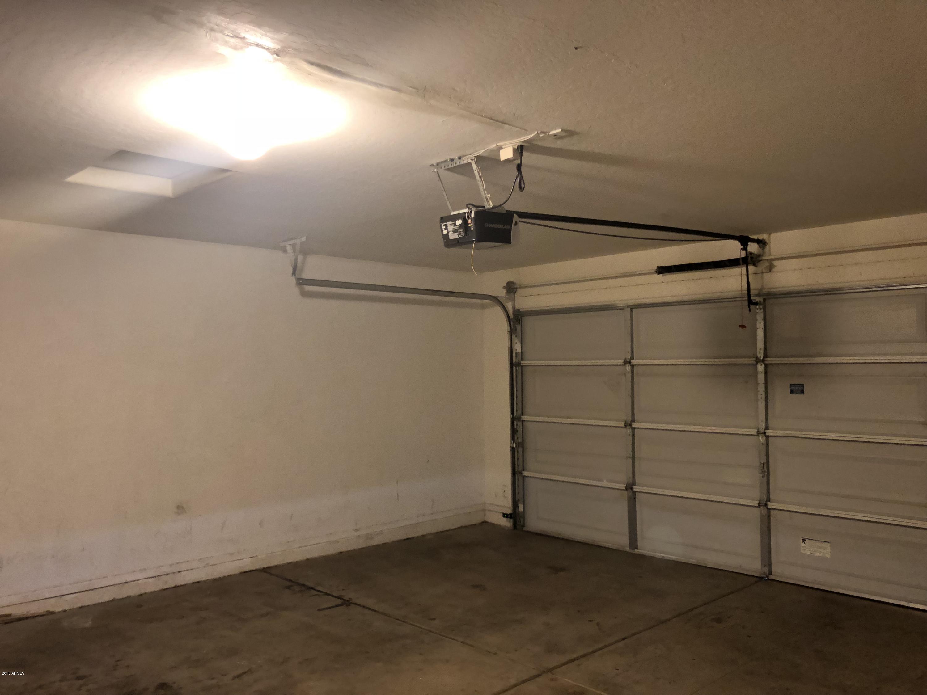 2321 West Maldonado Road Phoenix, AZ 85041 - Photo 26 of 44 a view of a room with racks on the wall