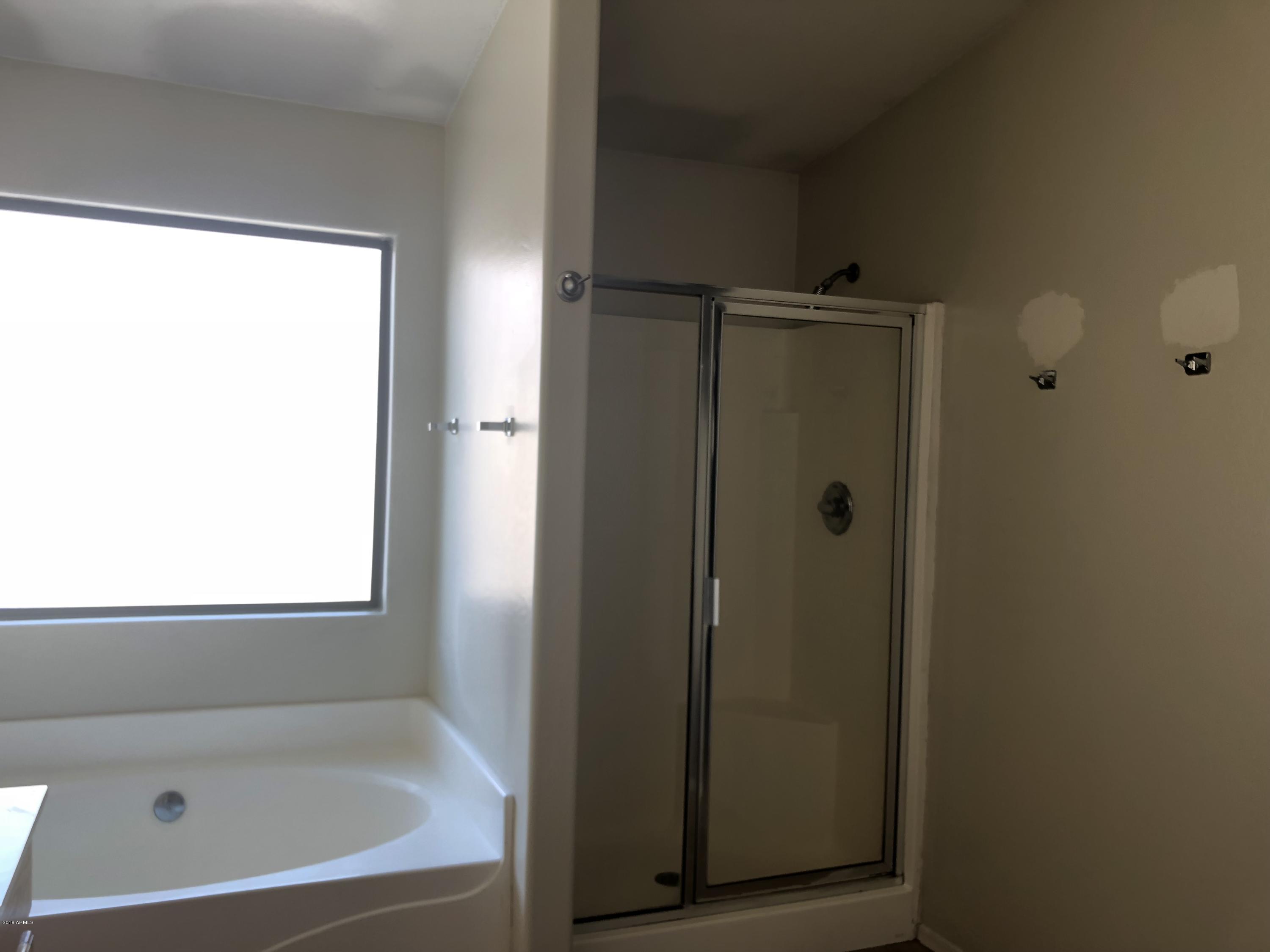 2321 West Maldonado Road Phoenix, AZ 85041 - Photo 29 of 44 a bathroom with a bathtub