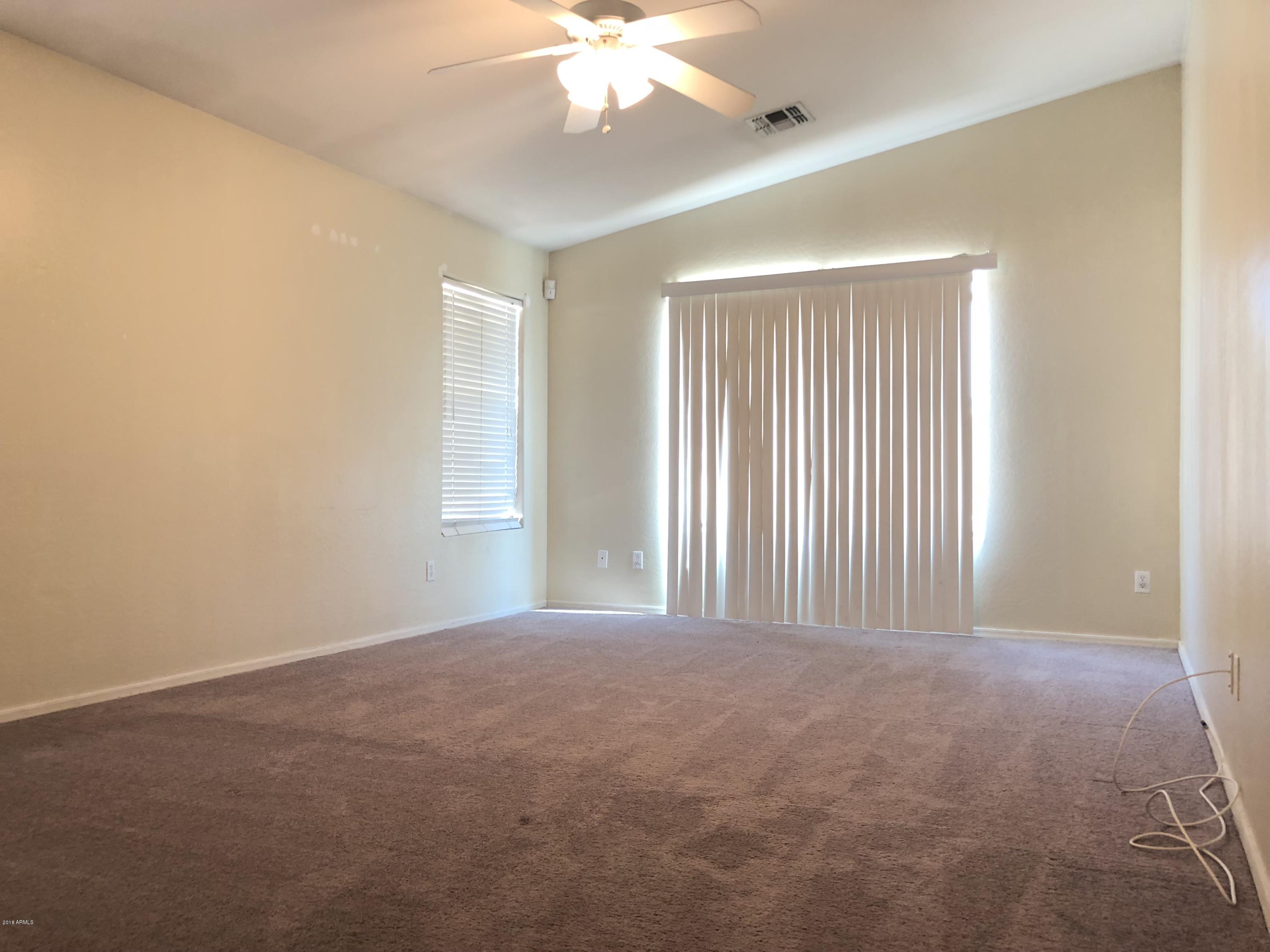 2321 West Maldonado Road Phoenix, AZ 85041 - Photo 30 of 44 a view of an empty room with a window