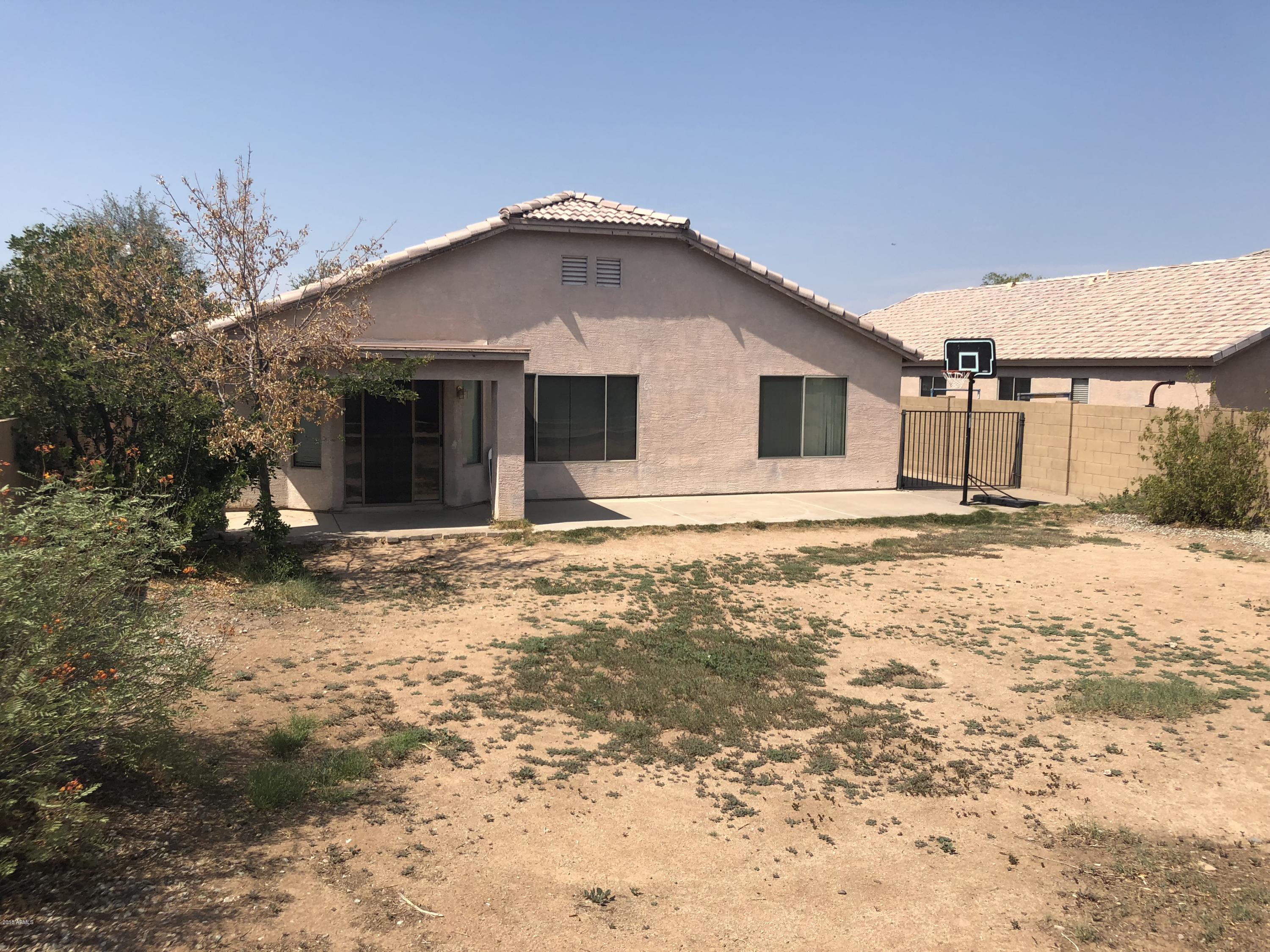 2321 West Maldonado Road Phoenix, AZ 85041 - Photo 39 of 44 a house that has a tree in front of it