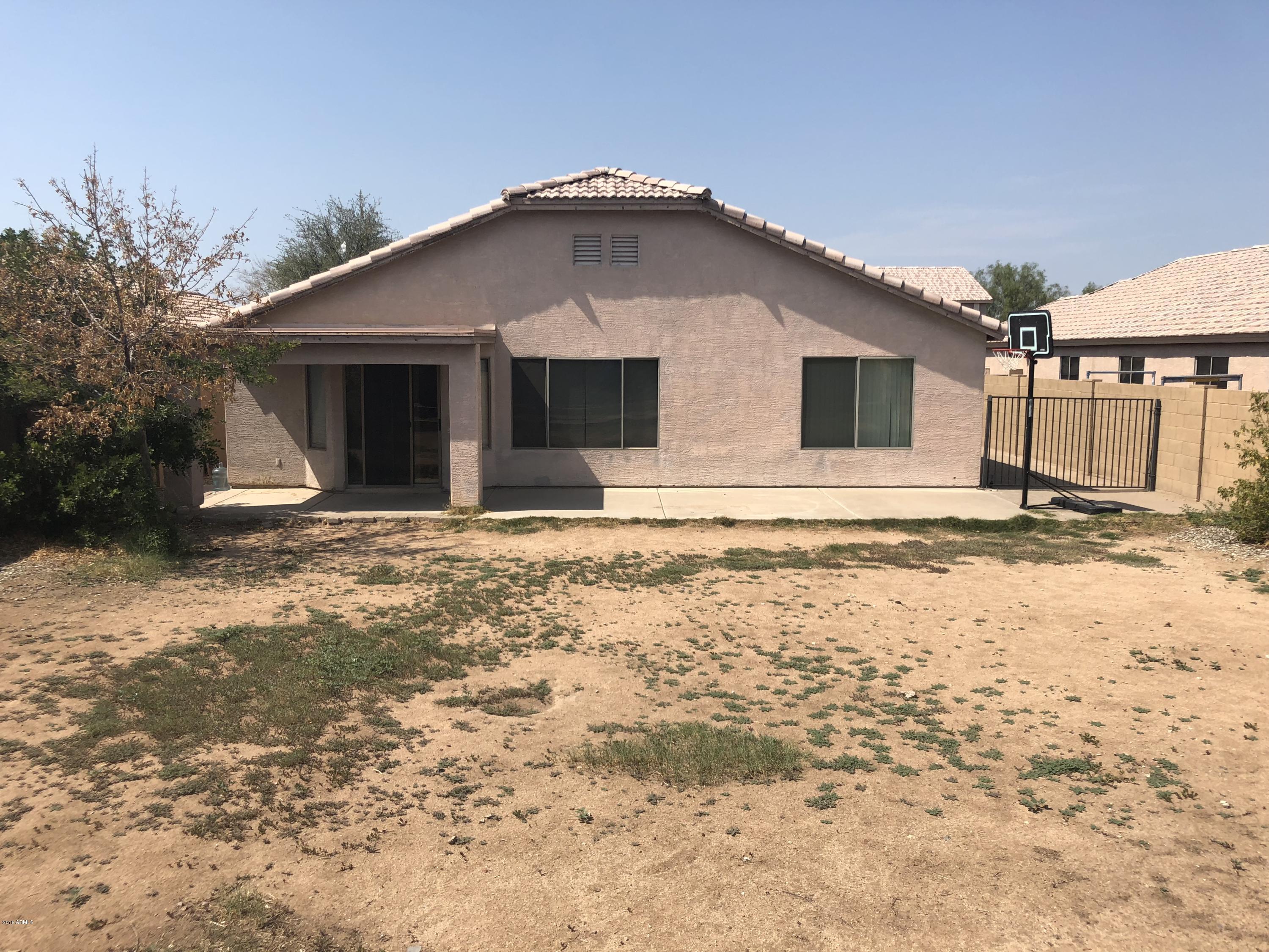 2321 West Maldonado Road Phoenix, AZ 85041 - Photo 40 of 44 a front view of a house with a yard