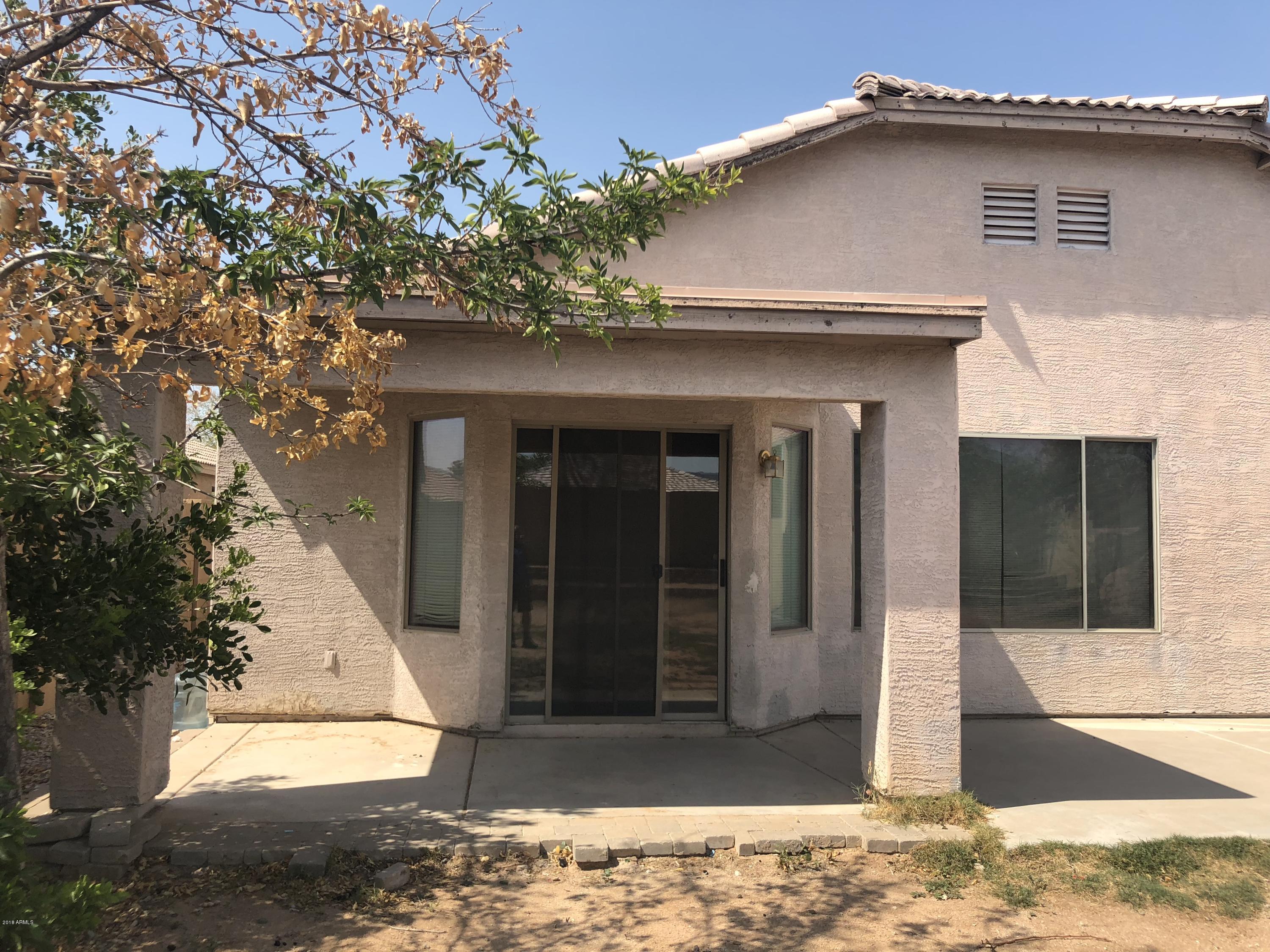 2321 West Maldonado Road Phoenix, AZ 85041 - Photo 42 of 44 a front view of a house with a glass door