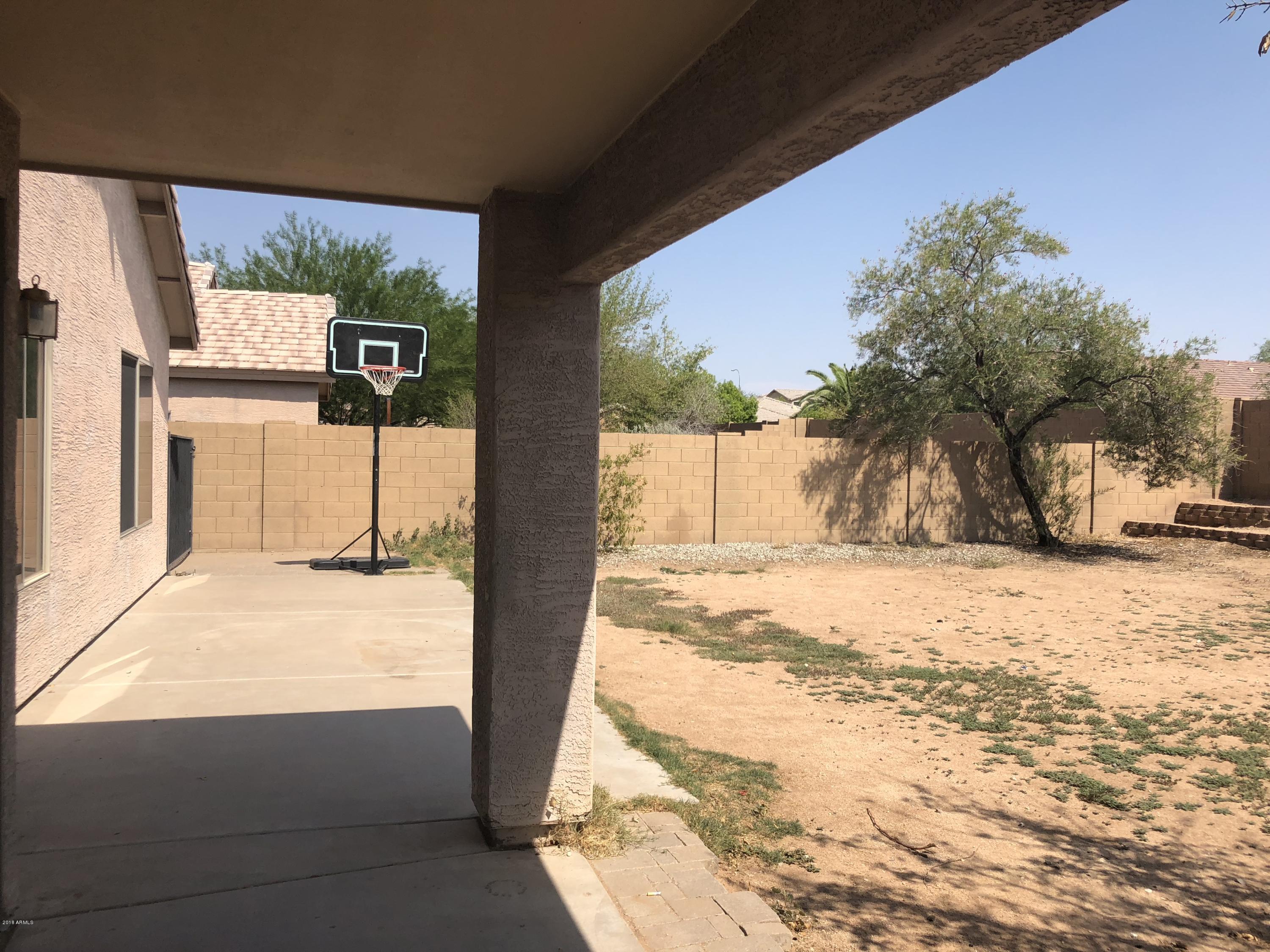 2321 West Maldonado Road Phoenix, AZ 85041 - Photo 43 of 44 a view of a road with a building in the background