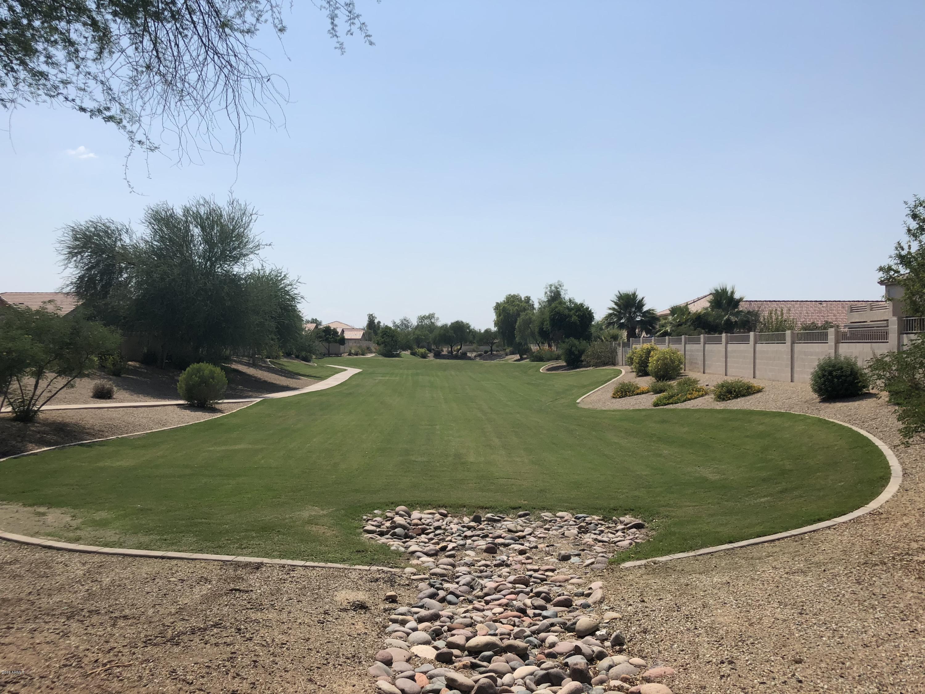 2321 West Maldonado Road Phoenix, AZ 85041 - Photo 44 of 44 a view of a golf course with a lake