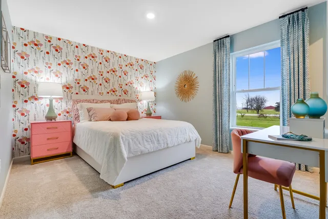 a bedroom with a bed and a table