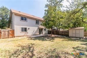 12011 Scribe Drive Austin, TX 78759 - Photo 14 of 14 a view of a house with a large tree and a yard