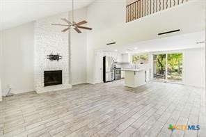 12011 Scribe Drive Austin, TX 78759 - Photo 2 of 14 a view of a kitchen with a sink and a window