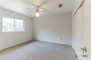 12011 Scribe Drive Austin, TX 78759 - Photo 10 of 14 an empty room with windows and fan