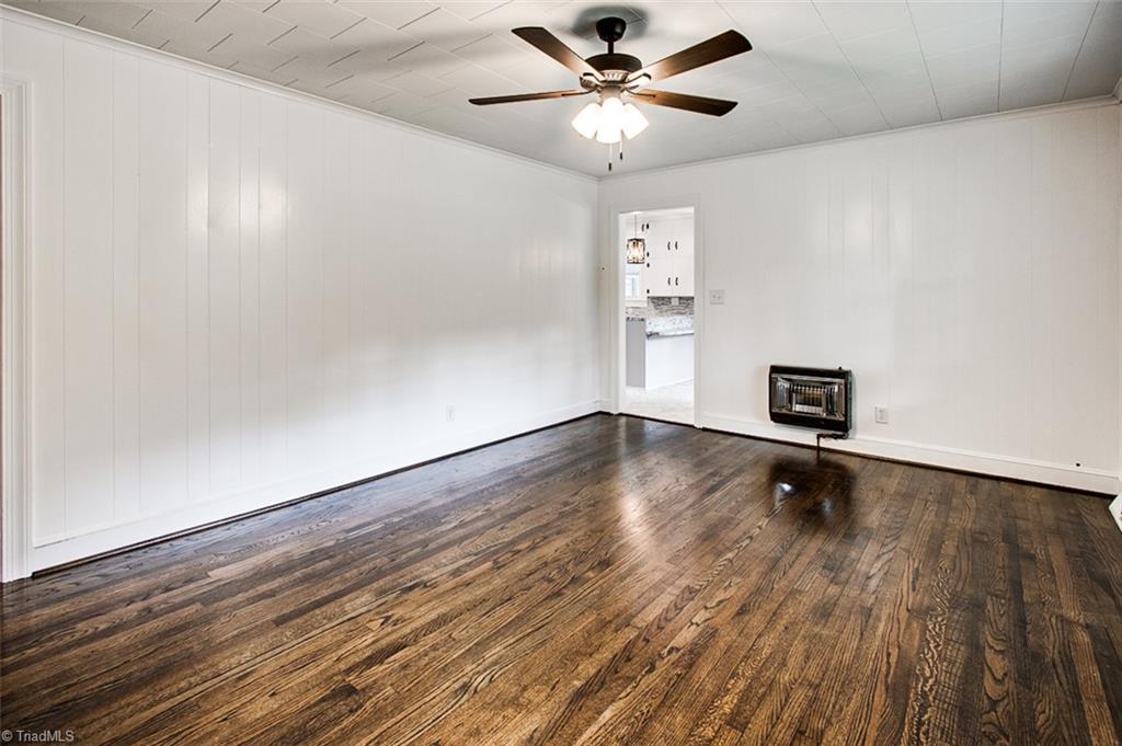 634 Foxfire Road Asheboro, NC 27205 - Photo 4 of 35 Reflection in photo - there is not a stain on floor by wall furnace
