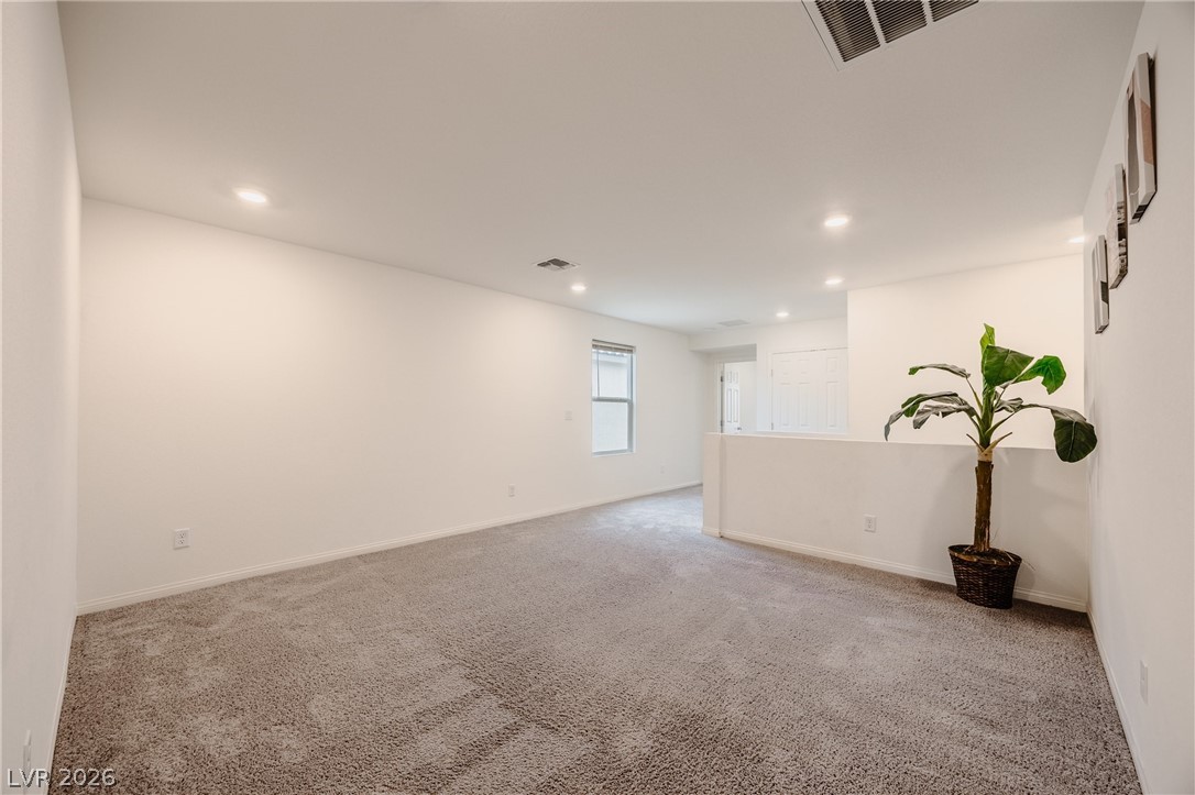 5927 Coja Street Las Vegas, NV 89113 - Photo 14 of 32 Spare room with carpet flooring, recessed lighting, and baseboards