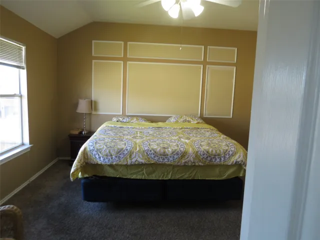 a bathroom with a shower and a glass door