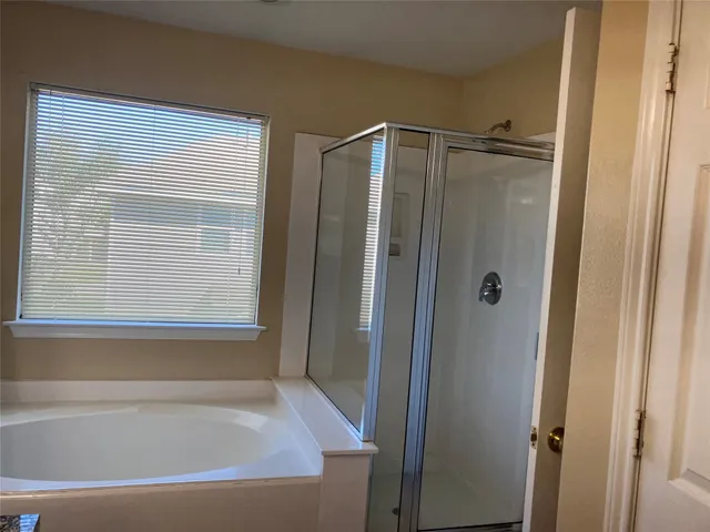 a view of backyard with small cabin and wooden fence