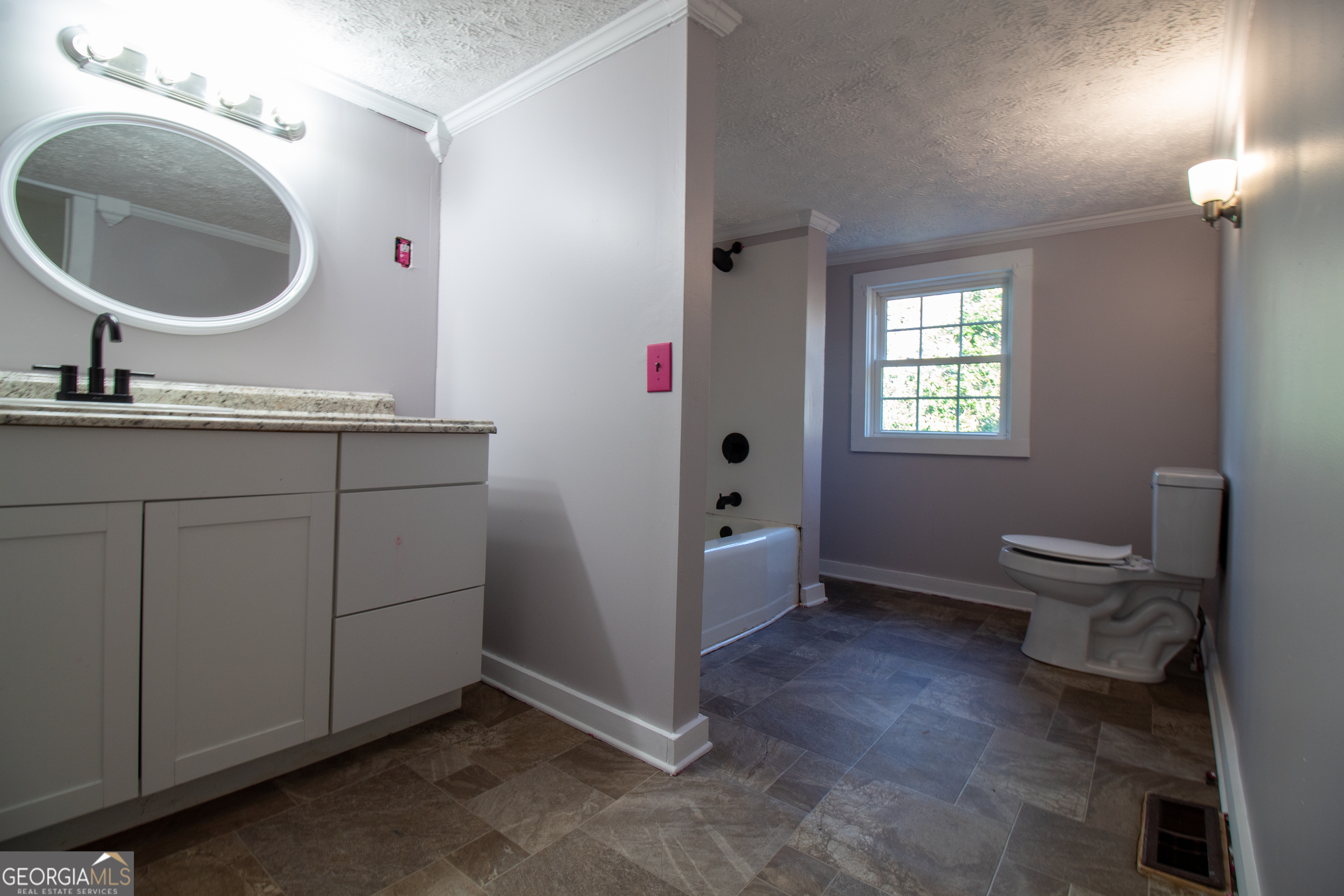 2 Wilson Street Manchester, GA 31816 - Photo 3 of 13 a en suite bathroom with a toilet sink and mirror