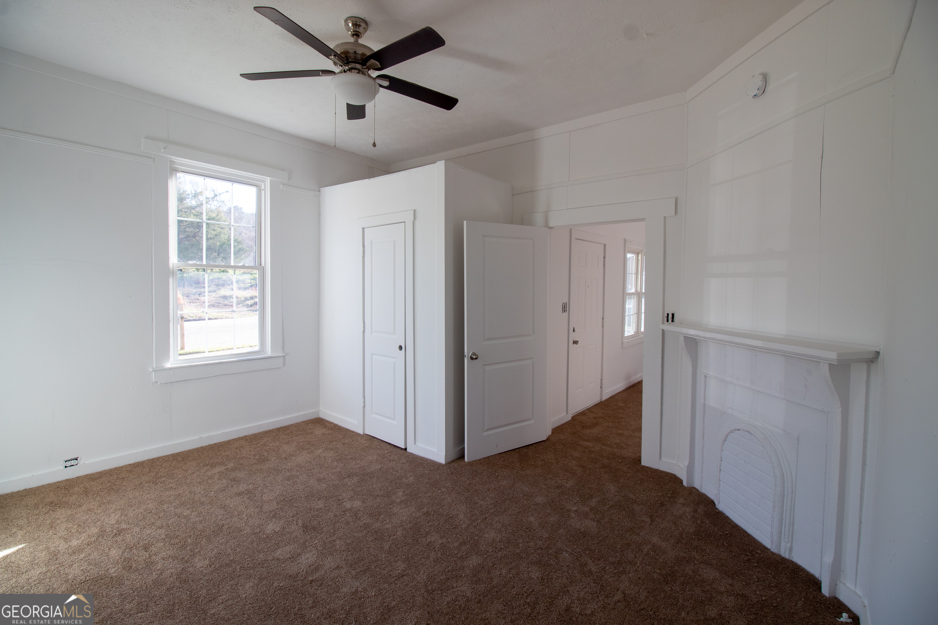 2 Wilson Street Manchester, GA 31816 - Photo 4 of 13 a view of an empty room with a window