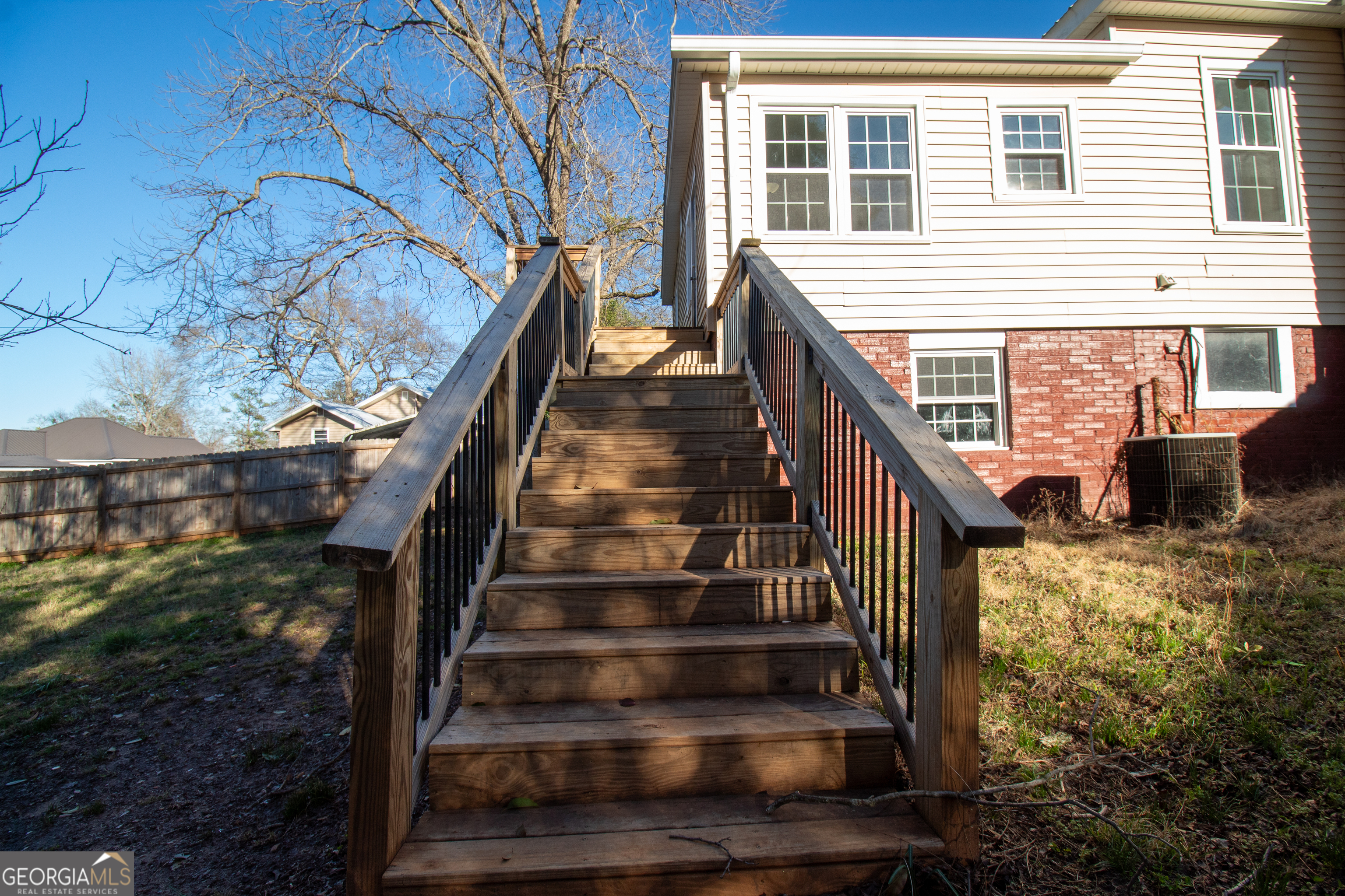 2 Wilson Street Manchester, GA 31816 - Photo 10 of 13 a view of entryway with wooden floor and stairs