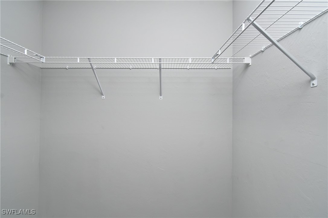 3103 Vera Avenue South Lehigh Acres, FL 33976 - Photo 12 of 36 a view of a room with racks on the wall