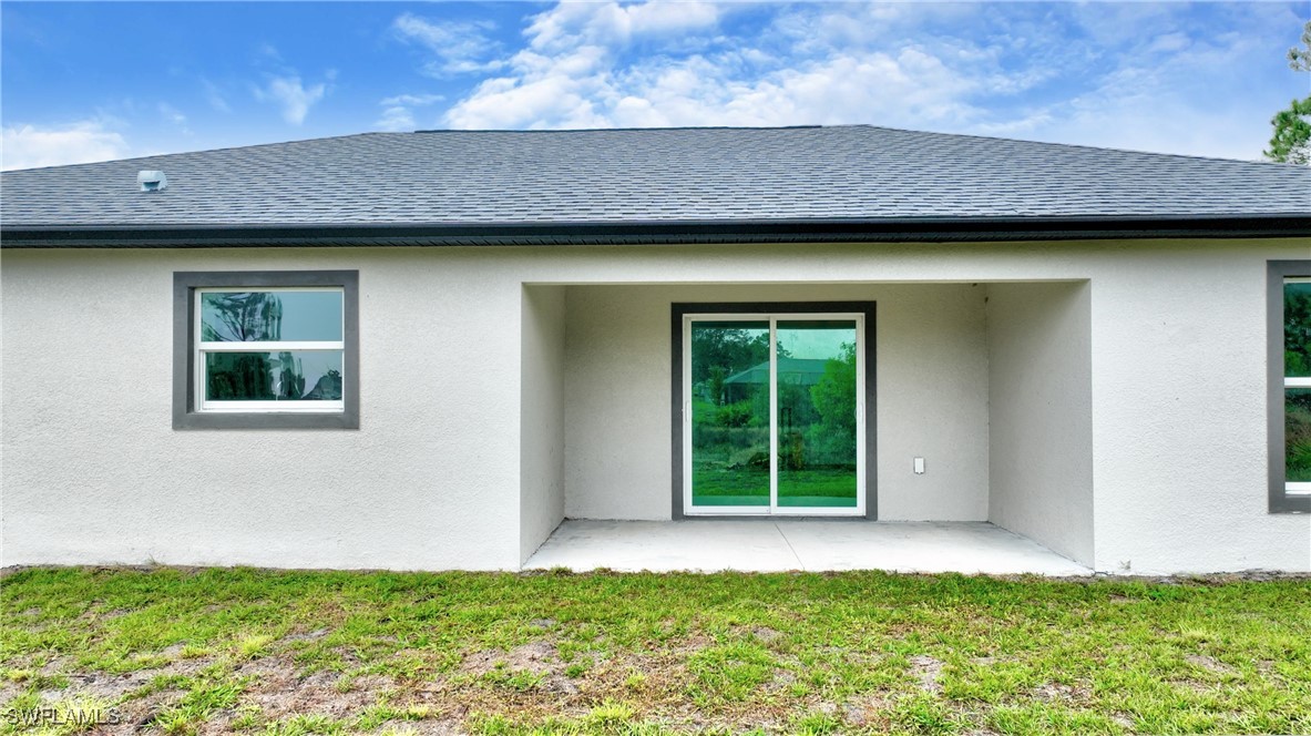 3103 Vera Avenue South Lehigh Acres, FL 33976 - Photo 34 of 36 a view of outdoor space yard and front view of a house