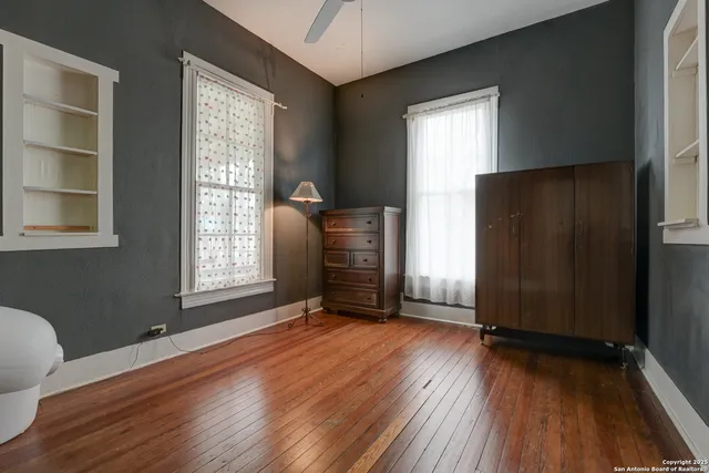 a white toilet sitting next to a bathroom sink