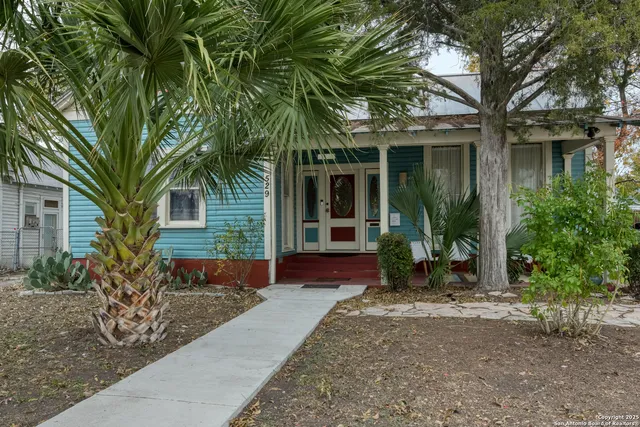 a view of a room with wooden floor cabinet and a window