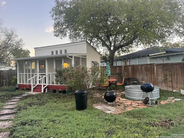 a kitchen with a stove a refrigerator and cabinets