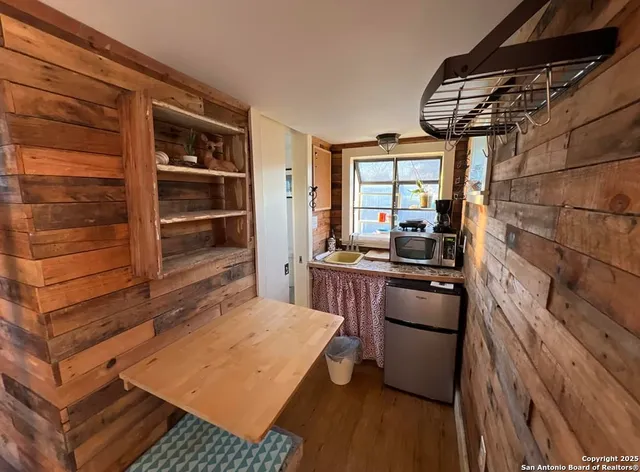 a bed room with a bed and a chair