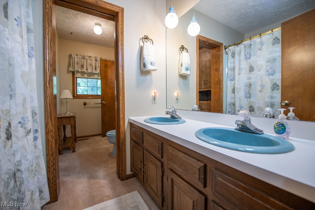 3949 Bair Road Northwest Dover, OH 44622 - Photo 30 of 48 Master bath room area featuring double sinks