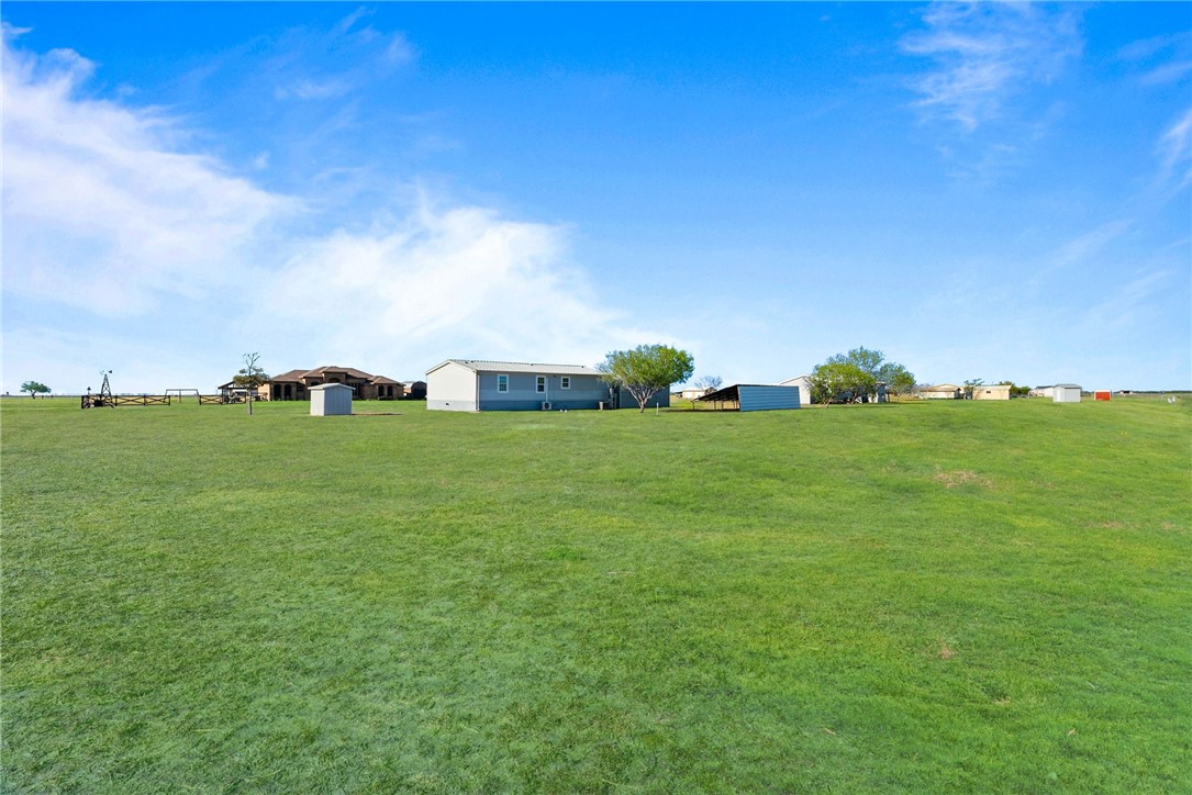 4752 Homestead Lane Robstown, TX 78380 - Photo 15 of 22 a backyard of a house with lots of green space