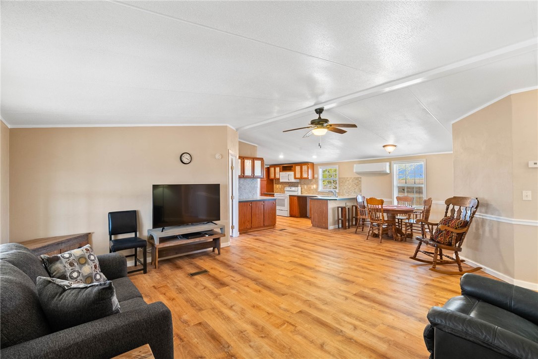 4752 Homestead Lane Robstown, TX 78380 - Photo 2 of 22 a living room with furniture and a flat screen tv