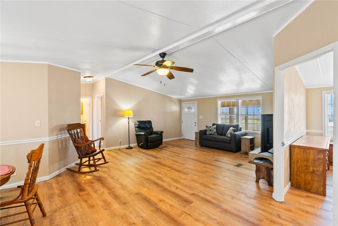 4752 Homestead Lane Robstown, TX 78380 - Photo 3 of 22 a view of a livingroom with furniture and a ceiling fan