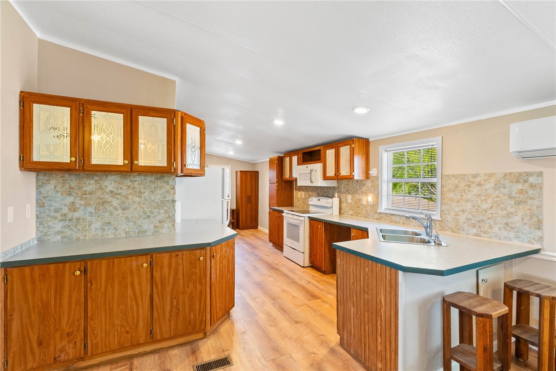 4752 Homestead Lane Robstown, TX 78380 - Photo 4 of 22 a dining hall with stainless steel appliances granite countertop a granite counter tops and a window