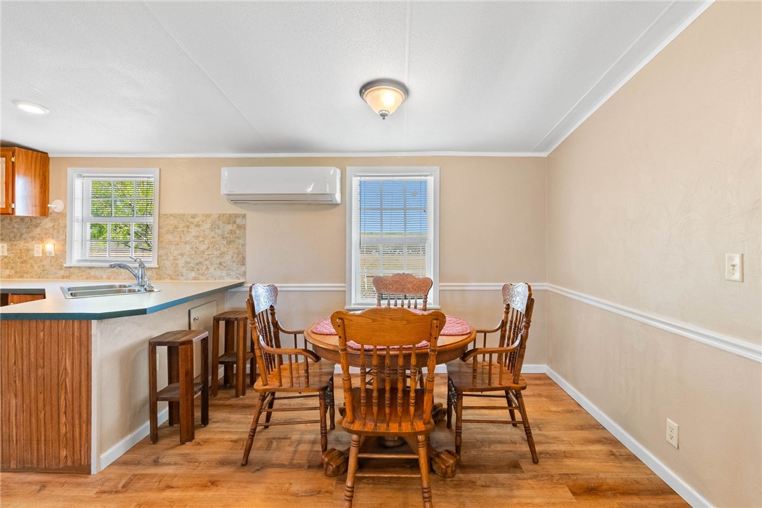 4752 Homestead Lane Robstown, TX 78380 - Photo 7 of 22 a dining room with furniture and window
