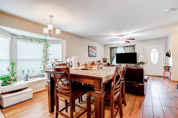 a view of a dining room with furniture and wooden floor