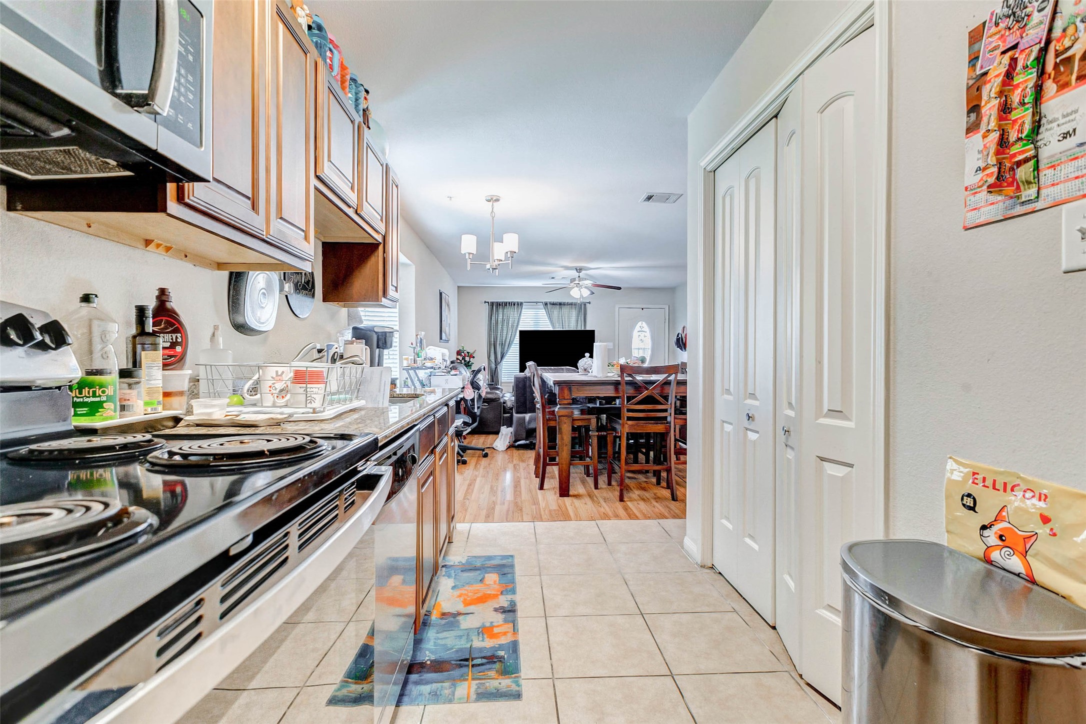 1702 Doyle Court, Unit 2 Pasadena, TX 77503 - Photo 14 of 30 a kitchen with stainless steel appliances granite countertop a sink stove and cabinets