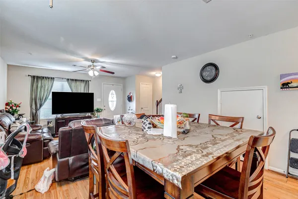 a view of a dining room with furniture and wooden floor
