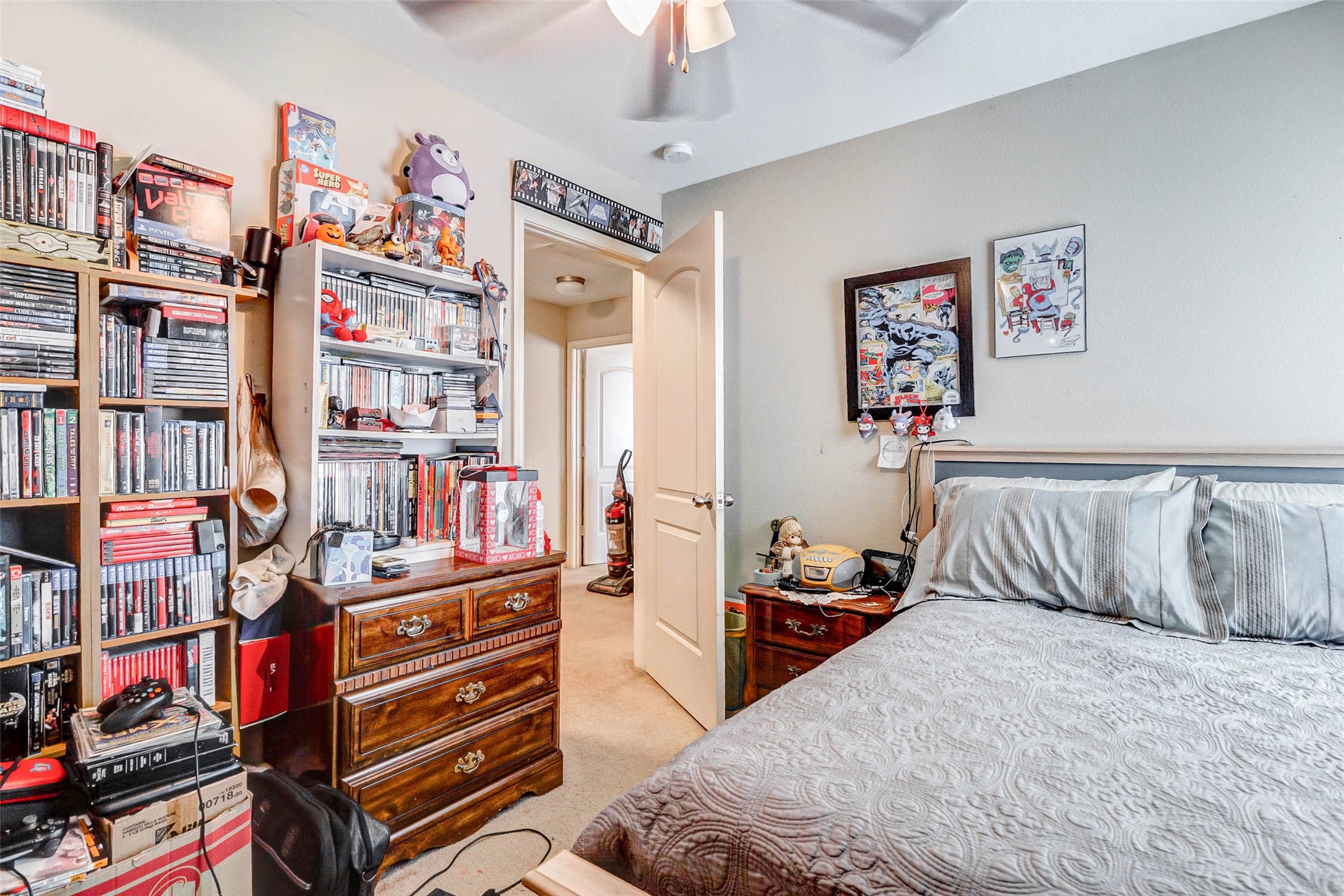 1702 Doyle Court, Unit 2 Pasadena, TX 77503 - Photo 24 of 30 a bedroom with furniture and a book shelf