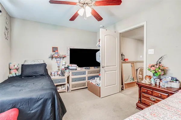 a living room with furniture and flat screen tv