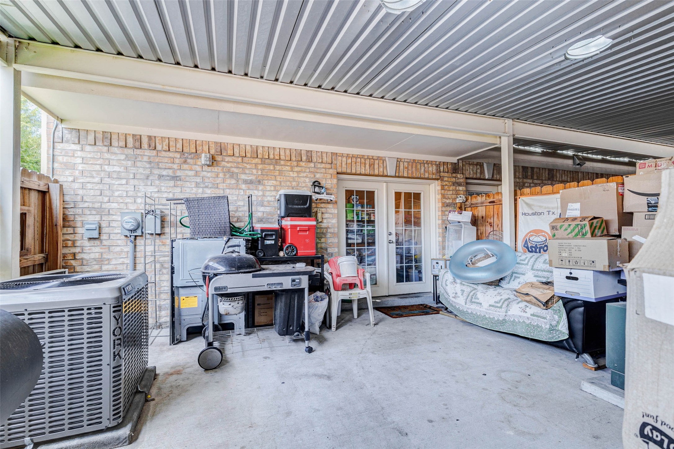 1702 Doyle Court, Unit 2 Pasadena, TX 77503 - Photo 30 of 30 a view of work room with furniture and a chandelier